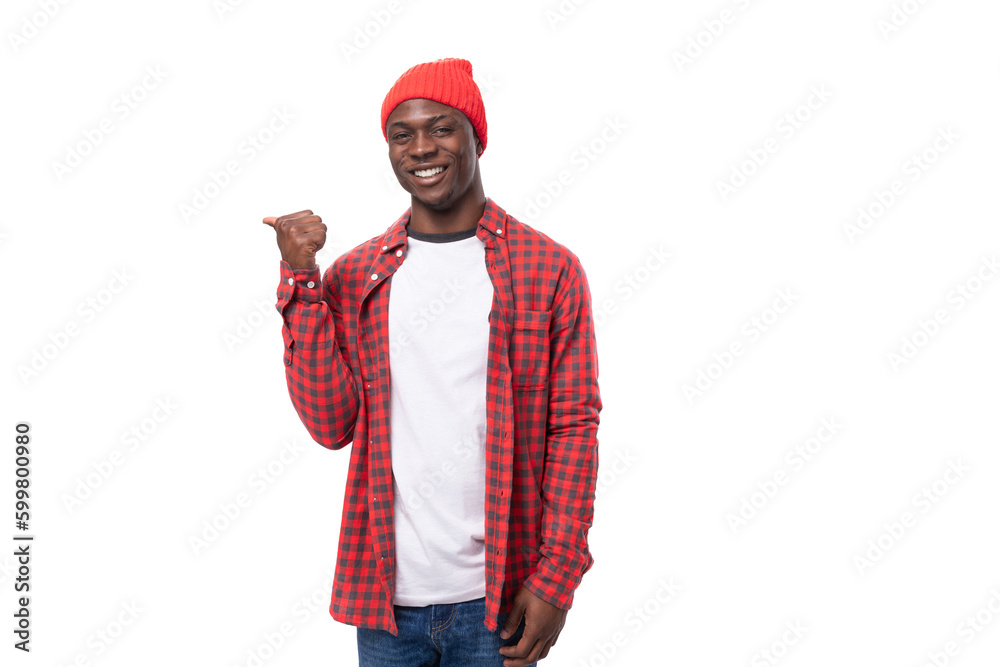 confident young ethnic african guy in stylish look pointing with index finger at promotional offer isolated on white background confident young ethnic african guy in stylish look pointing with index finger at promotional offer isolated on white background