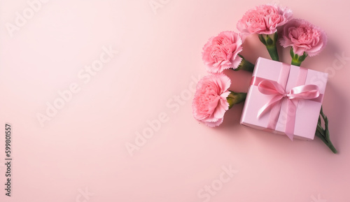 Mother's Day design concept - top view of a bunch of carnations, gift box on pink background for wedding and valentines Day with copy space for mock up, copy space