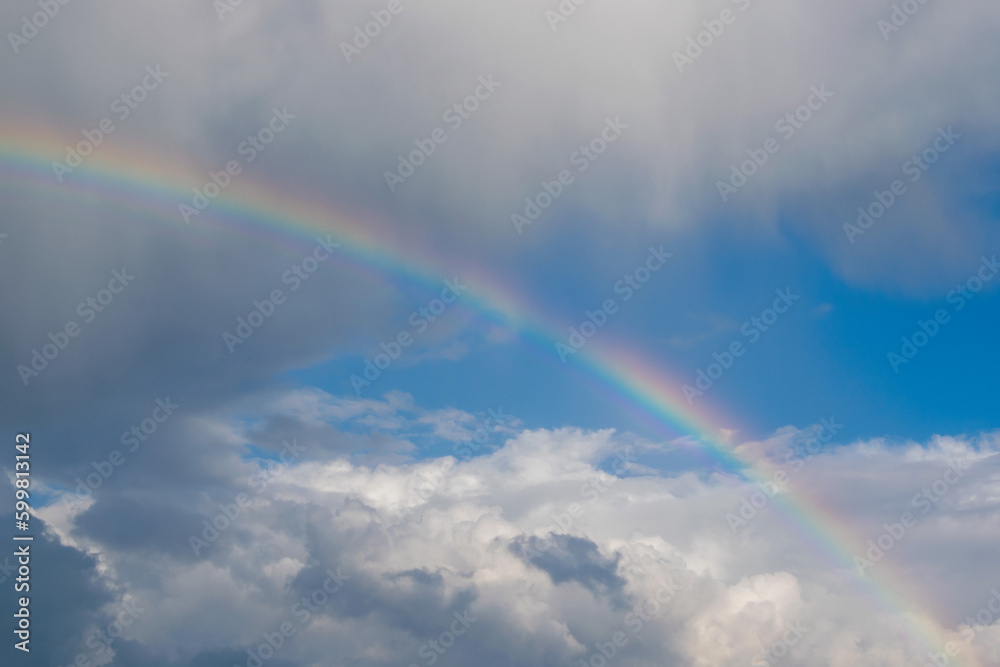 Rainbow in the cloudy sky