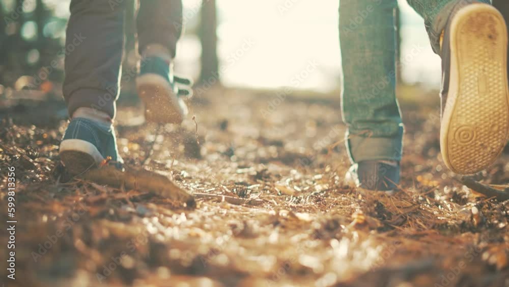 Children walk jogging in forest in nature.Active happy family travels on nature in park. Family picnic outdoors. Summer vacation, wind freedom in forest. Children walk in forest. Healthy lifestyle Children walk jogging in forest in nature.Active happy family travels on nature in park. Family picnic outdoors. Summer vacation, wind freedom in forest. Children walk in forest. Healthy lifestyle