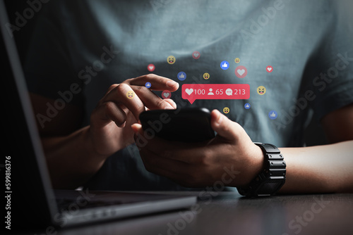 Social media and digital online concepts young man using smartphone with social media Holiday living and social media social distancing concept Work from home