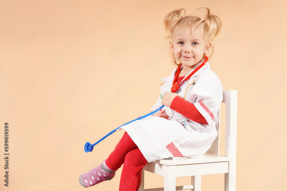 Girl with a stethoscope doctor on a white chair waiting for patients.