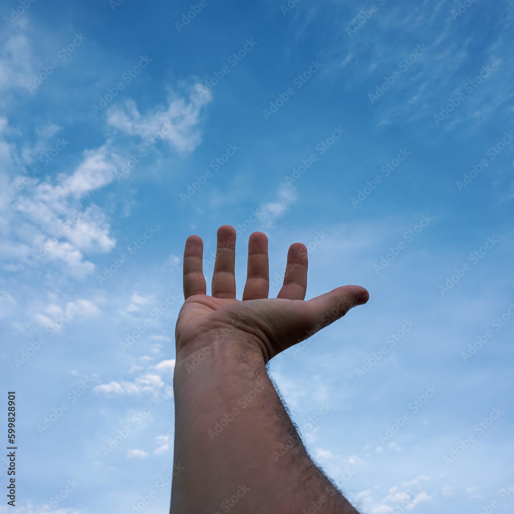 hand up gesturing in the blue sky, feelings and emotions hand up gesturing in the blue sky, feelings and emotions