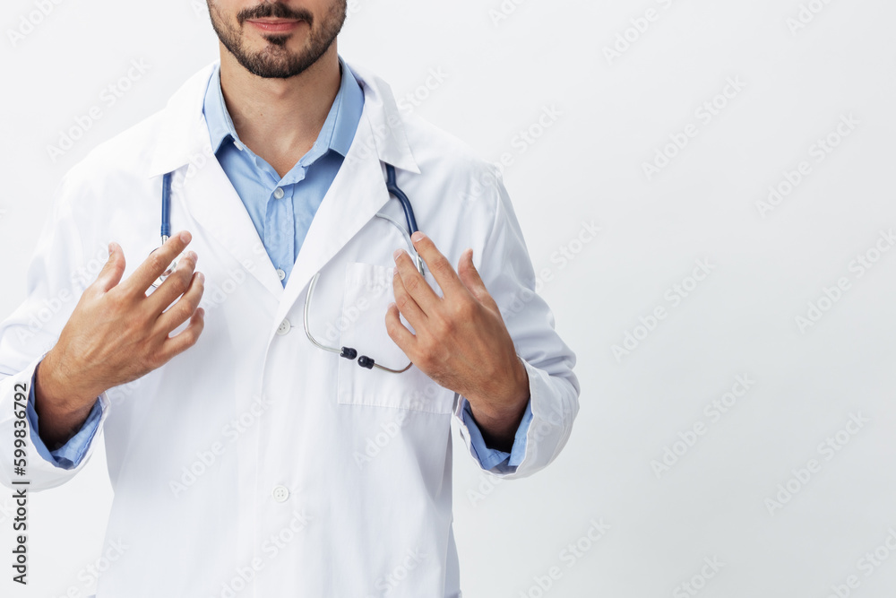 Man doctor in white coat with stethoscope and wearing glasses for vision smile with teeth on white isolated background looking into camera, copy space, space for text, health Man doctor in white coat with stethoscope and wearing glasses for vision smile with teeth on white isolated background looking into camera, copy space, space for text, health