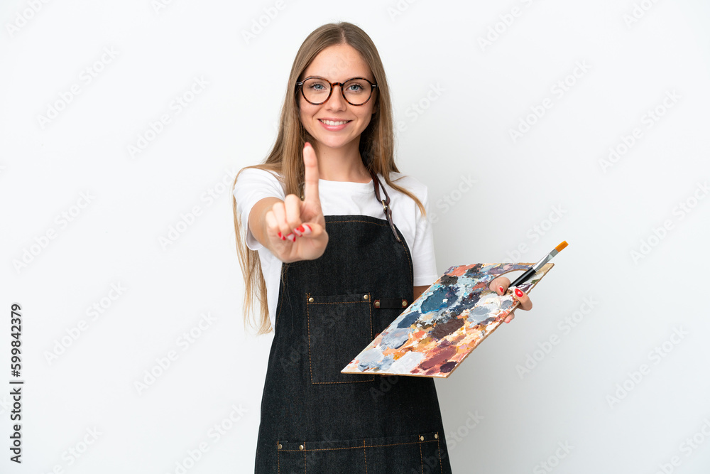 Young artist Lithuanian woman holding a palette isolated on white background showing and lifting a finger Young artist Lithuanian woman holding a palette isolated on white background showing and lifting a finger