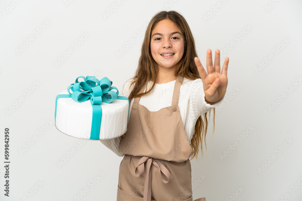 Little girl holding a big cake over isolated white background happy and counting four with fingers Little girl holding a big cake over isolated white background happy and counting four with fingers