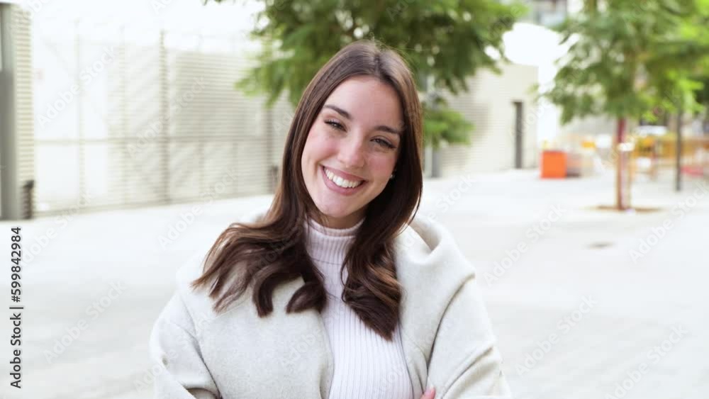 Portrait of young woman smiling happy standing at the city. Portrait of young woman smiling happy standing at the city.