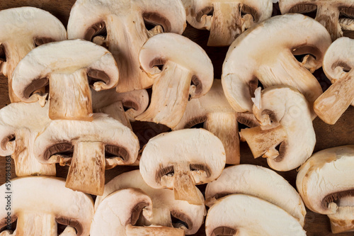 Fresh organic button mushroom forming a beautiful texture pattern background 