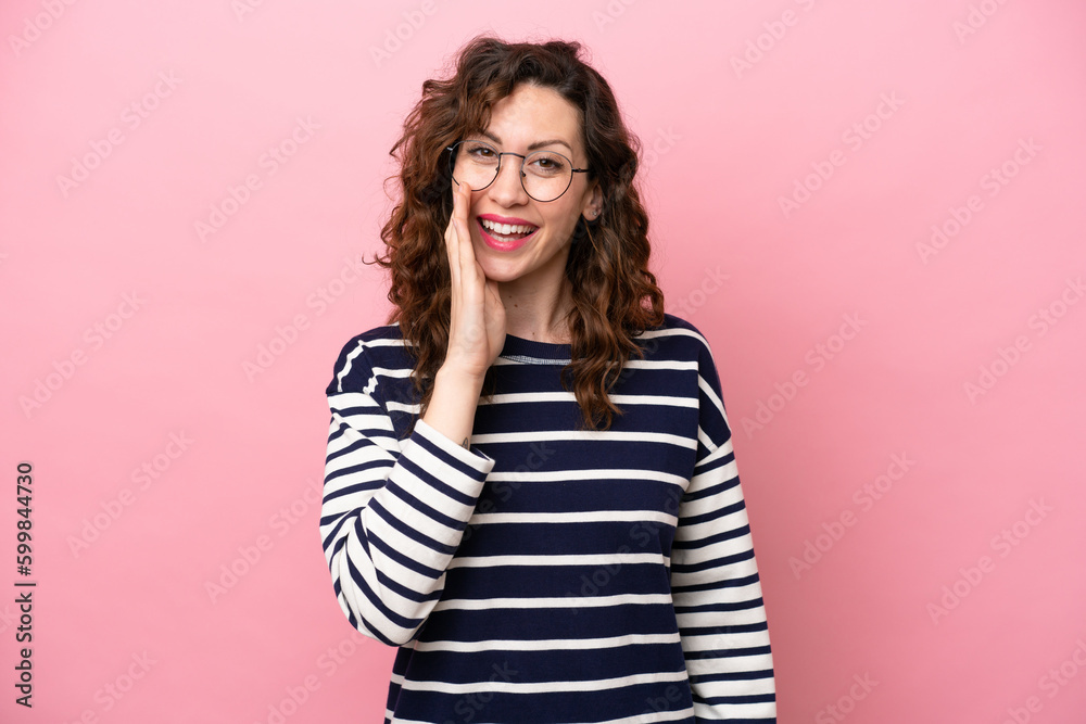 Young caucasian woman isolated on pink background shouting with mouth wide open Young caucasian woman isolated on pink background shouting with mouth wide open
