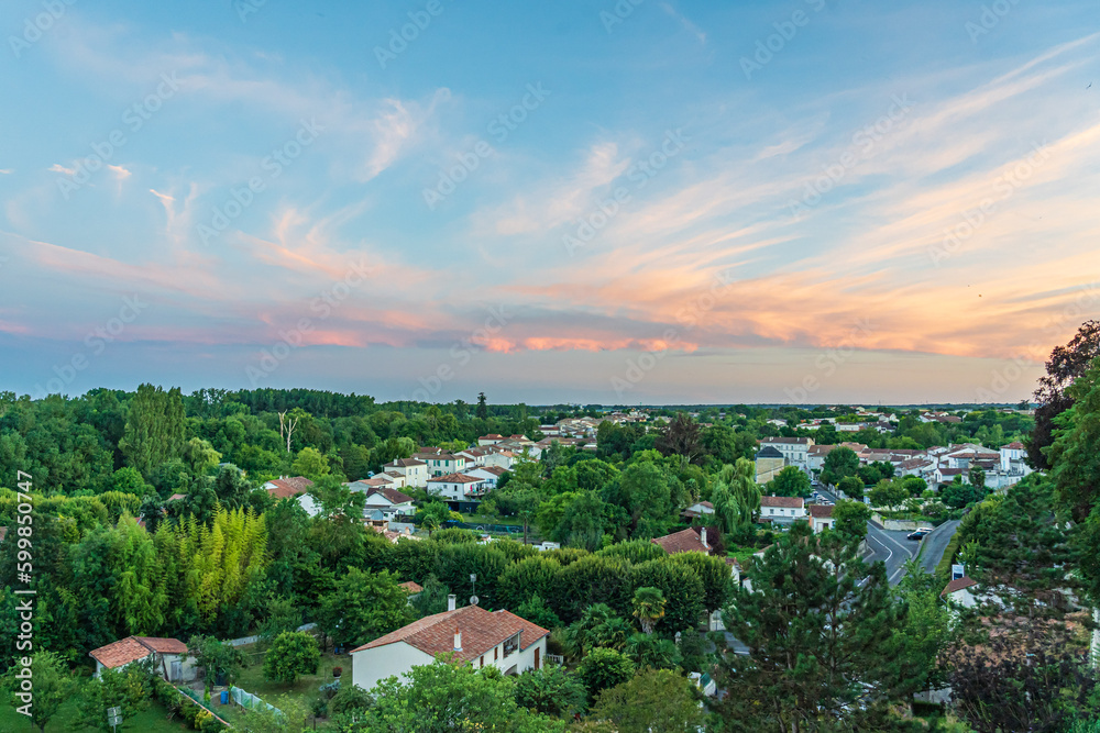 Fototapeta premium Evening view of the rooftops of Pons, France