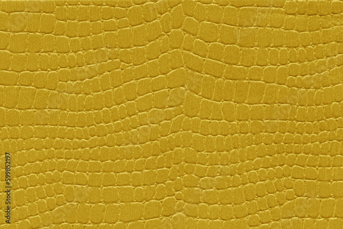 Yellow reptile skin. crocodile leather texture background photo