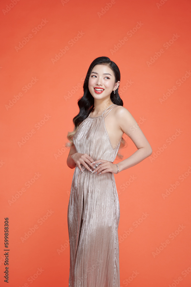 Beauty model with long curly hair. Christmas or New Year festivities. Beauty model with long curly hair. Christmas or New Year festivities.