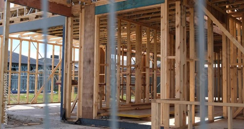 The wooden structure frame of a new residential house in a construction site. Concept of self build home, real estate development and property ownership. Melbourne VIC Australia
