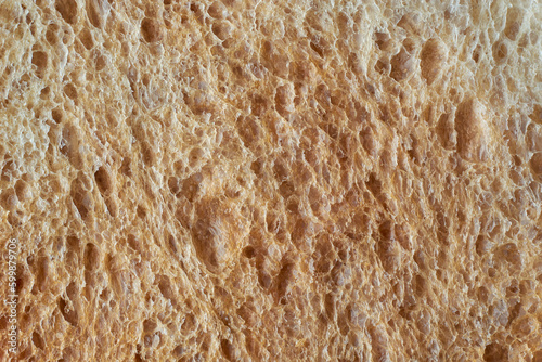 surface of bread crusts in full frame, popular food item in many cultures and used for making sandwiches, toast, and other dishes, lighter color and softer texture food background