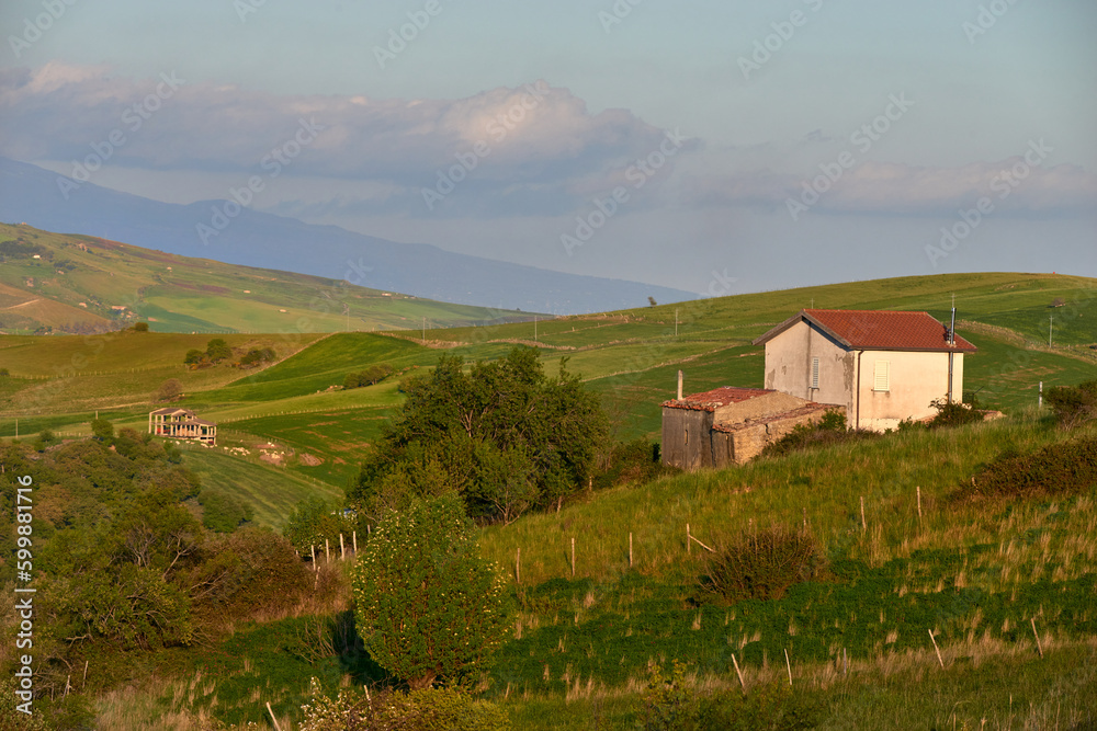 farmhouses among the spring pastures and hills of the Nebrodi mountains in Sicily