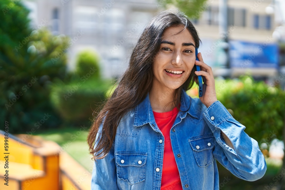 Young hispanic girl smiling confident talking on the smartphone at park Young hispanic girl smiling confident talking on the smartphone at park