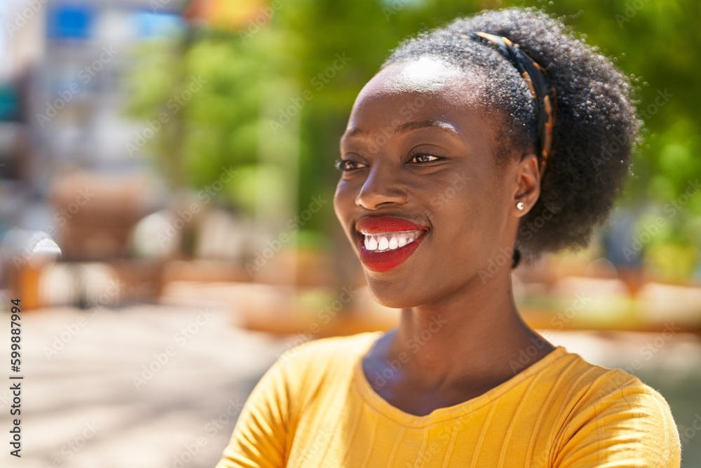 African american woman smiling confident looking to the side at park
