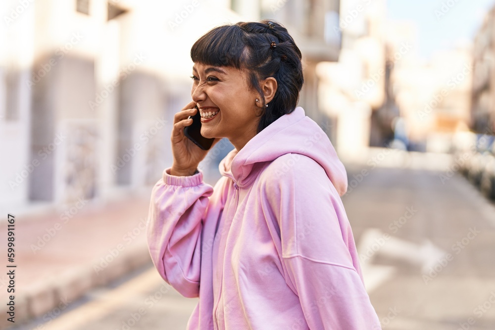 Young woman smiling confident talking on the smartphone at street Young woman smiling confident talking on the smartphone at street