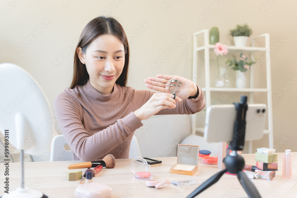 asian female beauty social media influencer livestream marketing cosmetics a make up tutorial via smartphone. asian female beauty social media influencer livestream marketing cosmetics a make up tutorial via smartphone.