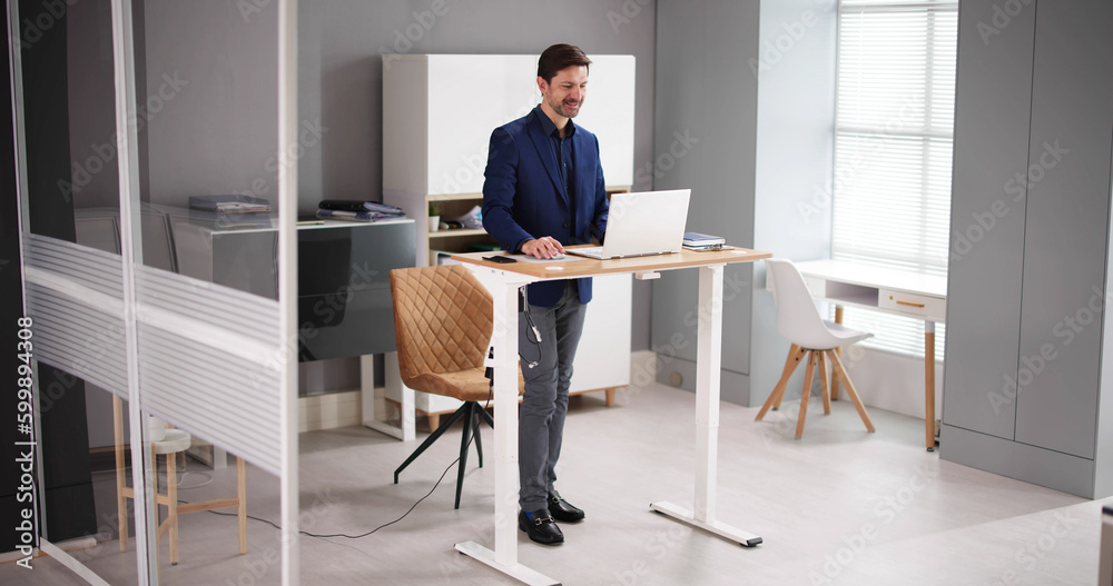 Adjustable Height Desk Stand In Office Adjustable Height Desk Stand In Office