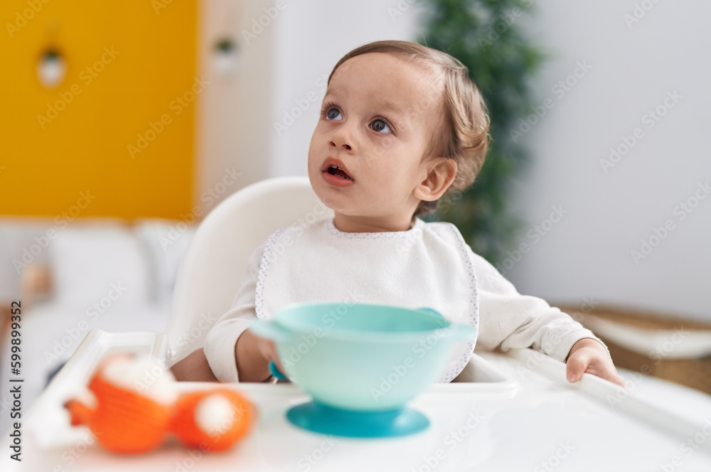 Adorable hispanic boy sitting on highchair at bedroom Adorable hispanic boy sitting on highchair at bedroom