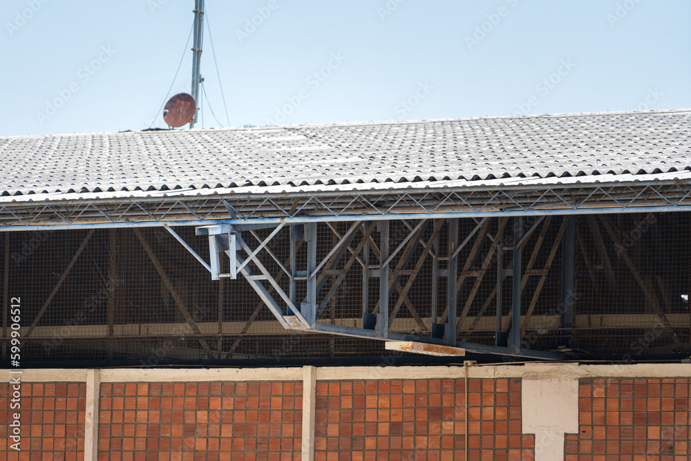 Iron balance beam of the roof structure of factory warehouse building. Close-up and selective focus. Iron balance beam of the roof structure of factory warehouse building. Close-up and selective focus.