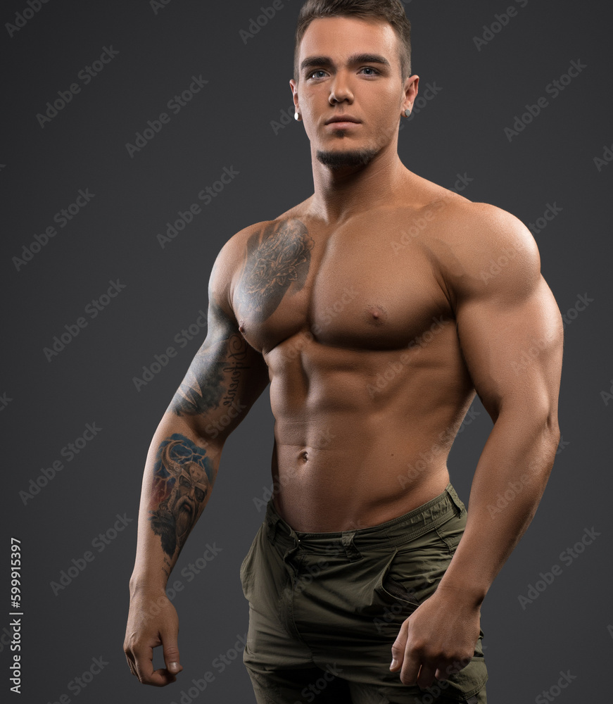 Fototapeta premium Fitness male model shirtless full-length portrait