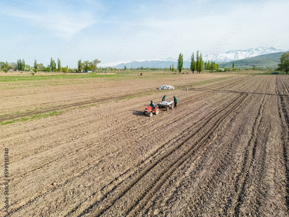 Aerial view of tractor plowing the field Aerial view of tractor plowing the field