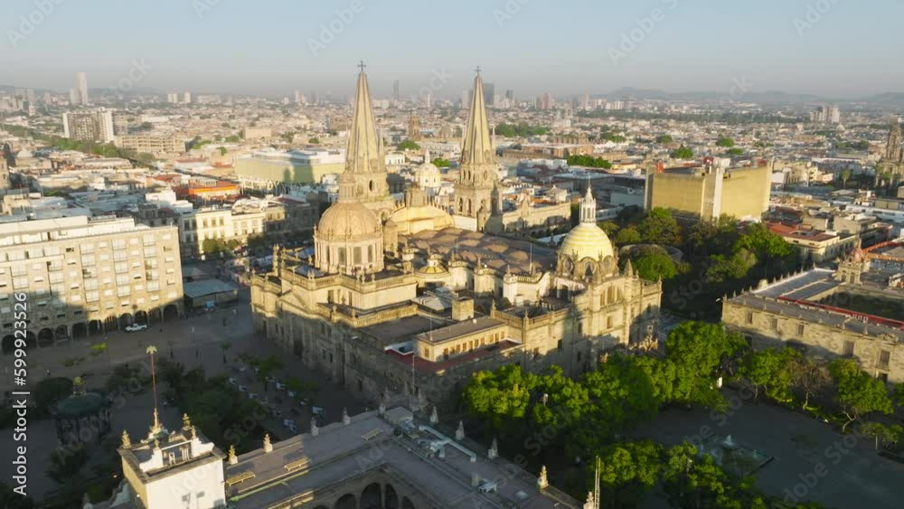 Gorgeous sunrise in Guadalajara Mexico. Aerial shot of Guadalajara city center with gothic cathedral and famous medieval spain architecture towers and domes on landmark religion building 4K Mexico