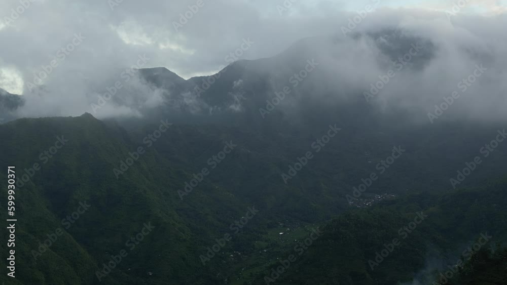 Aerial view of foggy nature in Amed. Amed is a 14-km strip of fishing villages in Karangasem Regency on the east coast of Bali, Indonesia Aerial view of foggy nature in Amed. Amed is a 14-km strip of fishing villages in Karangasem Regency on the east coast of Bali, Indonesia