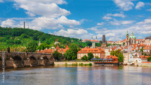 View of Prague Mala Strana old district and River Vltala with the famous Charles Bridge and Petrin Hill