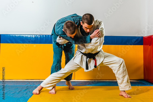 Brazilian jiu-jitsu and grappling training for men in a self-defense gym