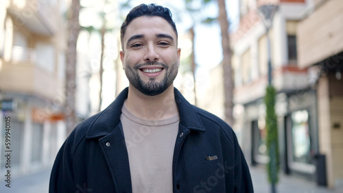 Young arab man smiling confident standing at street © Krakenimages.com