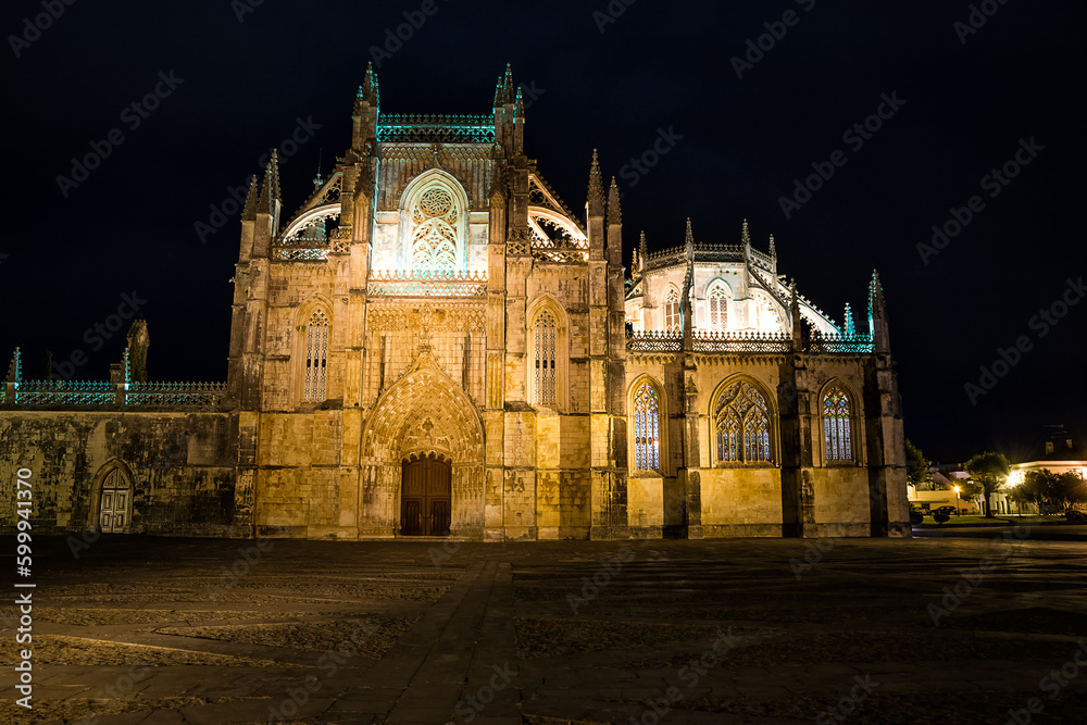 Facade of the Cathedral of Batalha at night (Portugal)