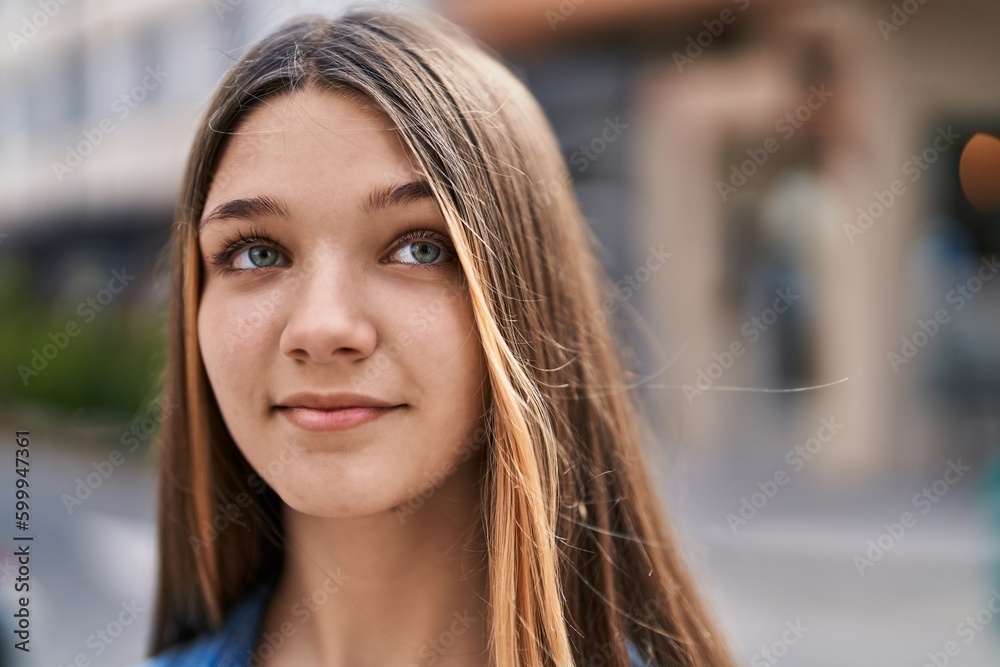Adorable girl smiling confident looking to the side at street Adorable girl smiling confident looking to the side at street
