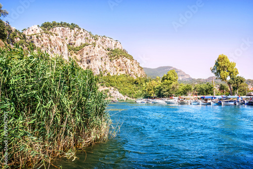 Fototapeta Naklejka Na Ścianę i Meble -  Boat on the Dalyan River, Lycian Tombs, Mediterranean Sea, Marmaris, Turkey