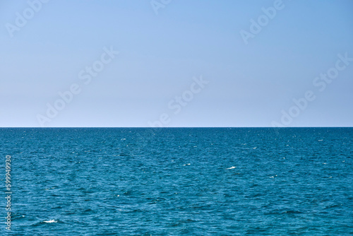 Closeup seascape surface of blue sea water with small ripple waves