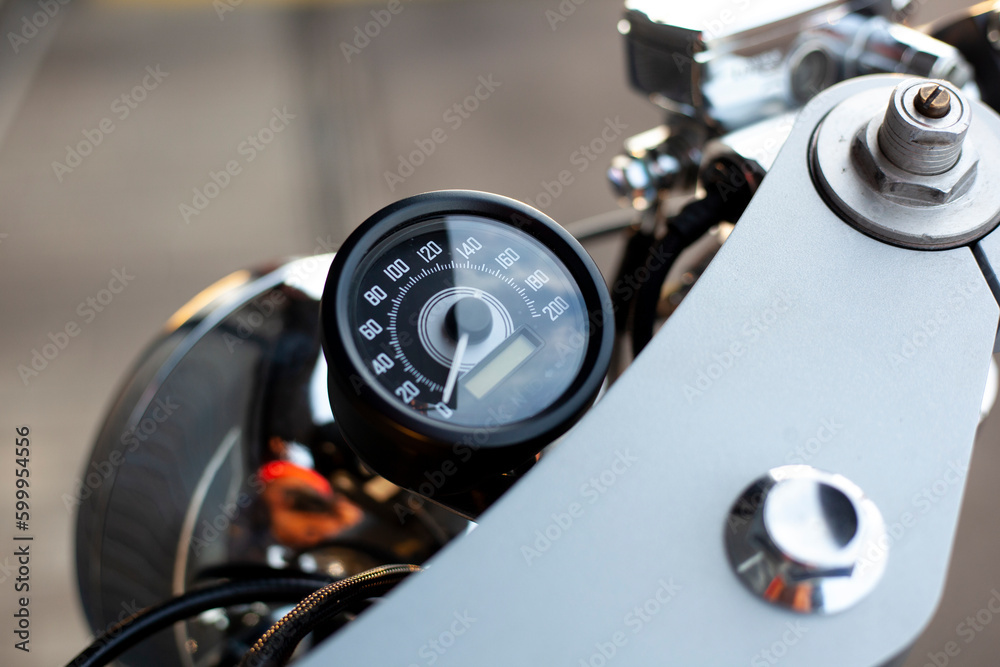 close-up of a motorcycle steering wheel with a speedometer close-up of a motorcycle steering wheel with a speedometer