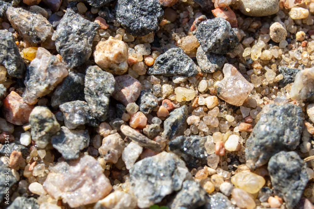 Small pebbles in the sand close up Small pebbles in the sand close up