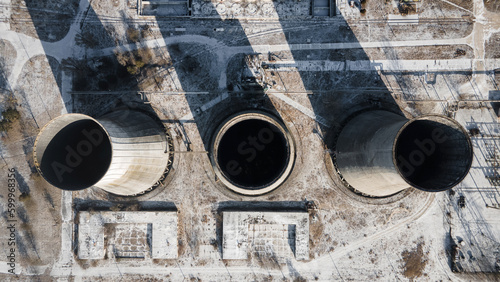 Abandoned non working thermal power plant from above in winter, in Hungary. Cooling towers.
