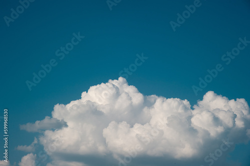 Cumulus clouds against the blue sky. High quality photo
