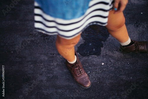 hipster woman legs in boots on pavement