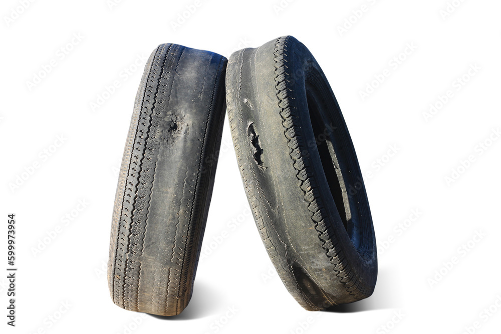 old worn out tire next to another old tire isolated on white background old worn out tire next to another old tire isolated on white background