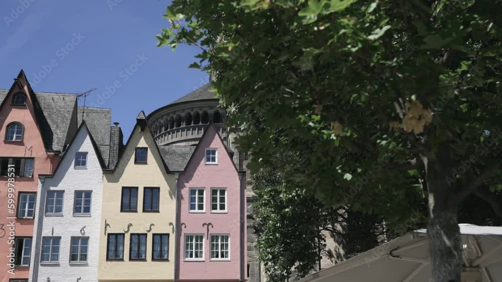 View of church Gross St Martin with unique colorful houses in the old town of Cologne, Germany View of church Gross St Martin with unique colorful houses in the old town of Cologne, Germany