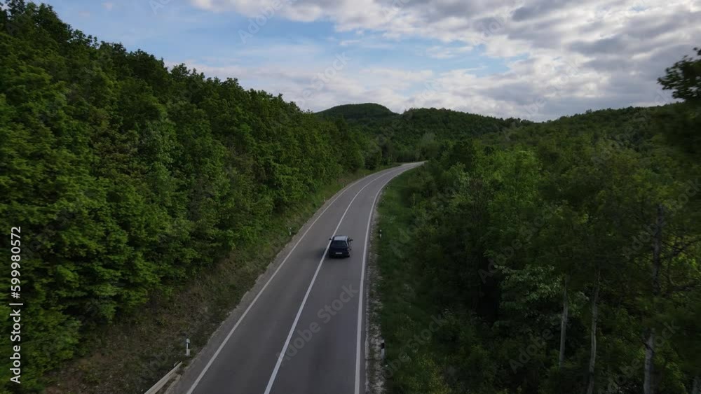 Aerial Drone View Car Driving on Curvy Mountain asphalt Road in Spring Aerial Drone View Car Driving on Curvy Mountain asphalt Road in Spring