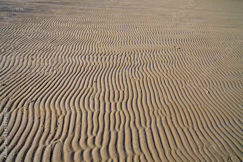 Line wave on sand beach after sea water receded.