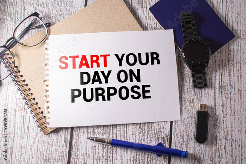 Start your day on purpose - inspirational handwriting on a napkin with a cup of coffee.