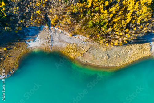 Drone view of the lake and forest in the glacier valley. View of the moraines. Landscape from the air. Lake on a moraine. Landscape from drone. Abstract view for wallpaper. Alberta, Canada.