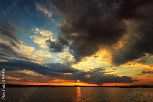 Tranquil sunset over the water with stunning cloud formations