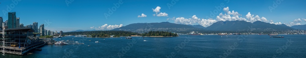 Panorama of Vancouver Harbour including the Trade and Convention Centre with views of Burrard Inlet and North Shore Mountains, BC Canada travel and tourism